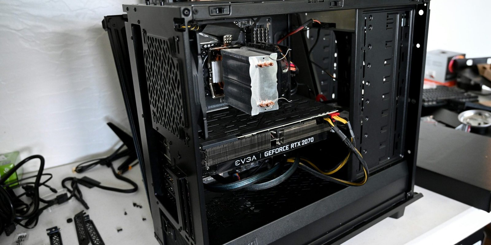 black computer tower on black computer tower on white table